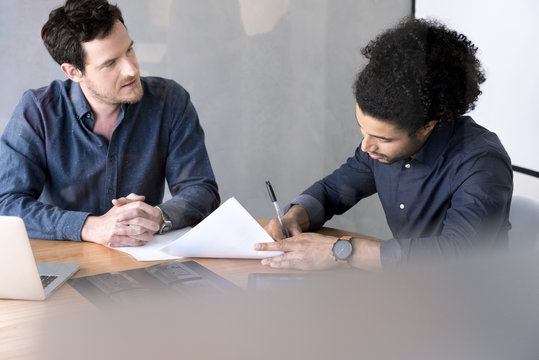 Man signing document