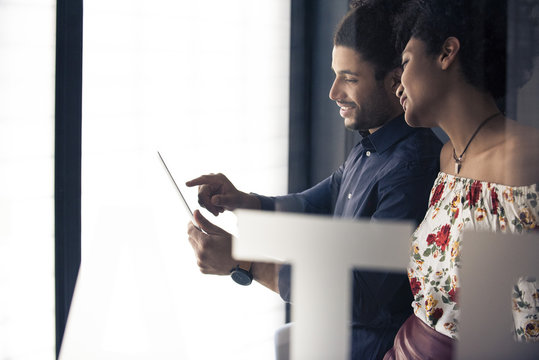Couple looking at digital tablet together