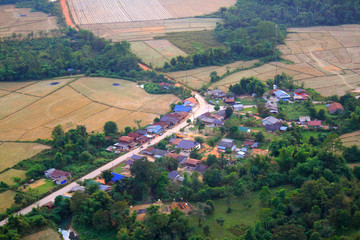 Aerial view of Vangvieng village and rice field with the forest at Vangvien,Laos