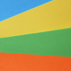 Fototapeta premium Pieces of colored torn paper as a background. copy space