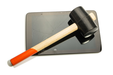 Damaged screen tablet and hammer on top, isolated on white