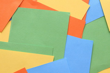 Pieces of colored torn paper as a background. copy space