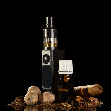 Electronic cigarette and cigar, liquid for Smoking, spices, isolated on black