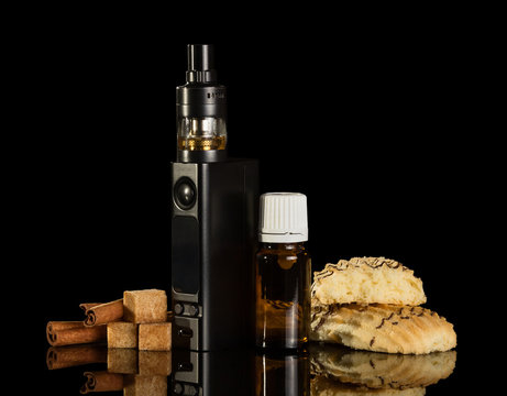 Electronic cigarette and liquid with smell of cinnamon for Smoking isolated on black