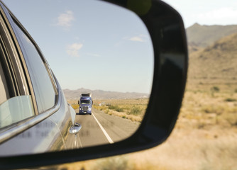 Side mirror of a car in the heart of the desert