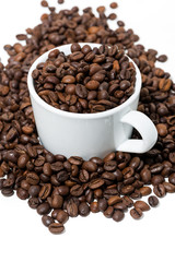 cup with coffee beans on white background, vertical