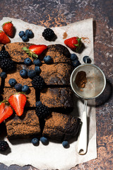 dessert - chocolate brownies with fresh berries, vertical