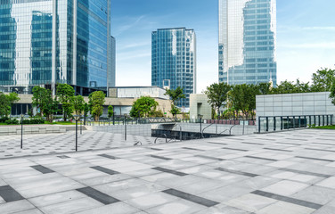 Panoramic skyline and buildings with empty concrete square floor