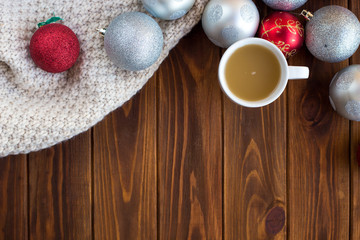 Christmas tree toys on a wooden table. Preparation for the New Year
