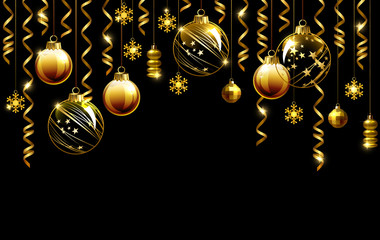 Glass Christmas evening balls on a black background. New year gold decorations with garlands.