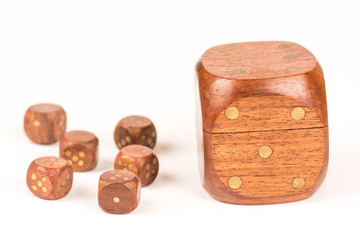 Big and small wooden dices isolated on white background, gambling and lucky concept