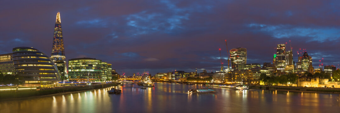 London - The panorama of riverside and skyscrapers at dusk.