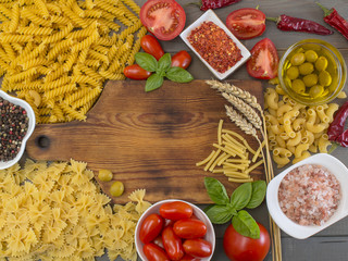Italian pasta on a wooden table. 