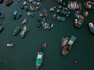 Fototapeta na wymiar Aerial Top View Boat in The Aberdeen Bay, Famous Floating Village in Hong Kong