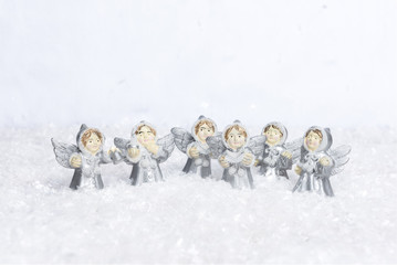 Angels choir singing for christmas in the snow