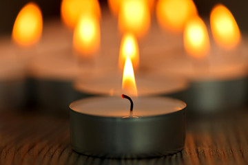 Many small burning candles