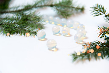 macro shooting of natural mineral rock specimen - tumbled translucent moonstone gemstone on white...