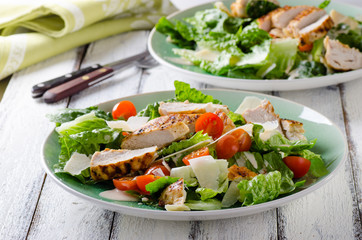 Grilled chicken salad with tamatoes and parmesan cheese