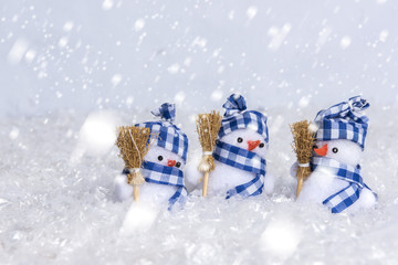 Snow man gathering in a snow setting positioned on the right side