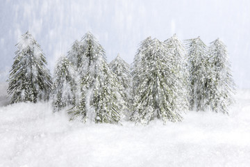 forest winter wonderland with figurines in snow setting