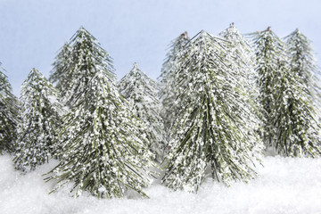 forest winter wonderland with figurines in snow setting