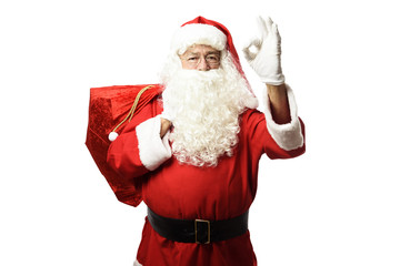 Santa Claus with red bag on white background OK gesture