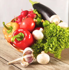 Pile of organic vegetables on a wooden table