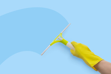 Employee of the service cleans the glass .