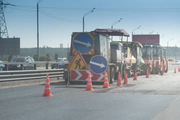 red and white Cones on the asphalt around a zone of road repairs