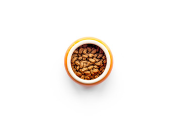 Pet food in bowl on white background top view copyspace