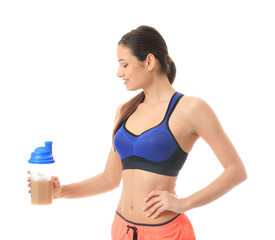 Beautiful young woman with protein shake on white background