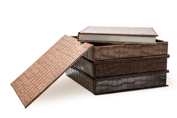 hardcover books lying on a white background