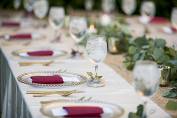 Elegant table set up for dinner for either wedding reception or Christmas.