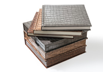 hardcover books lying on a white background