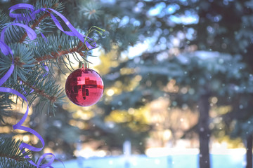 New Year. Christmas decoration. On the spruce hanging ball and serpentine. - 180901403