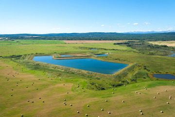 Fototapeta premium An aerial photo of a man made lake at the farmers field. 