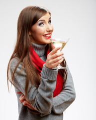 Smiling woman wearing red scarf drinking alcohol drink.