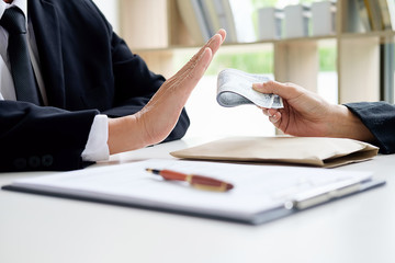 Hand giving money to other hand. anti Corruption concept