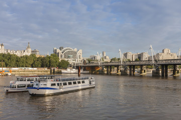 Fototapeta na wymiar Hungeford Bridge and Golden Jubilee Bridges in the morning, London, England