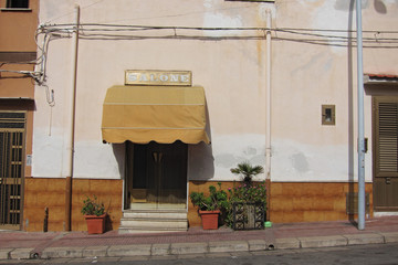 San Vito Lo Capo, Italy - September 01, 2011: View of a barbershop entrance in San Vito Lo Capo