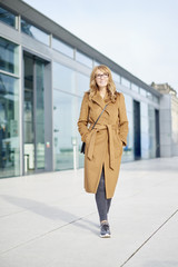 Fototapeta premium Woman walking on the street