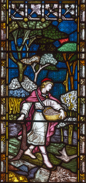 LONDON, GREAT BRITAIN - SEPTEMBER 19, 2017: The Parable of the Sower on the stained glass in St Mary Abbot's church on Kensington High Street.