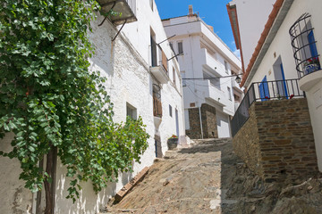 Traditional narrow street with white houses in historical center of city