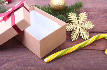 Gift boxes with bow and christmas decoration on wood background