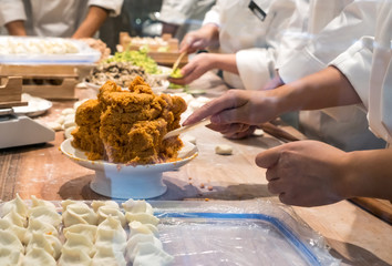 Obraz na płótnie Canvas Chef is making dumplings