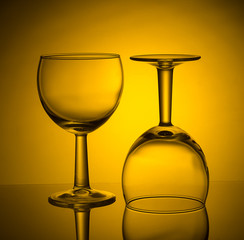 Drinking empty wineglasses on colored background, copy space.