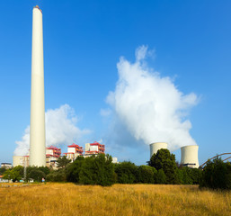 Industrial plant with chimney and cooling towers