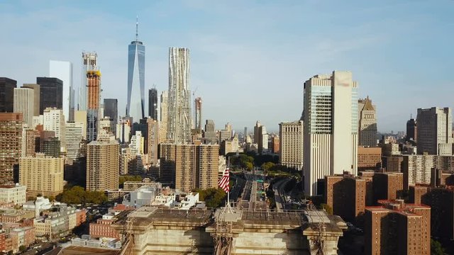 Aerial view of New York, Manhattan district with skyscraper. Dronw flying over the Brooklyn bridge near East river.