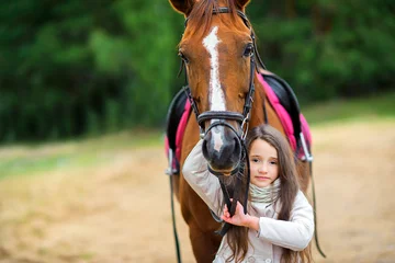 Foto op Canvas teen girl walks with her favorite horse. © Tortuga