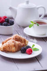 European breakfast tea coffee milk croissant fresh berries morning